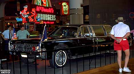 Kennedy's Death Car (a 1961 Lincoln) and an exhibit of fast food signage.